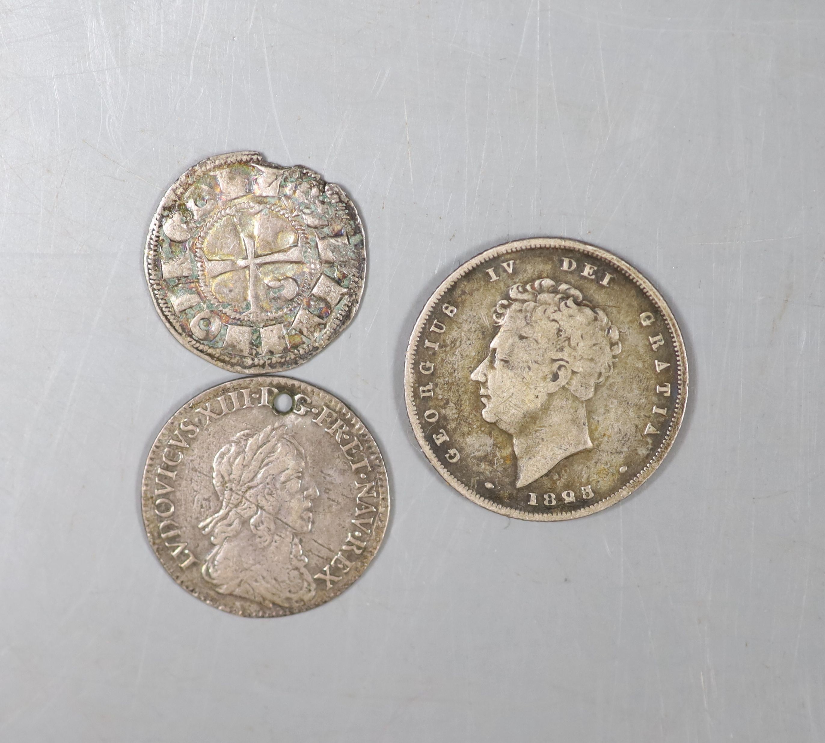 A Louis XIII 1643 five sols and a George IV shilling and a medieval coin